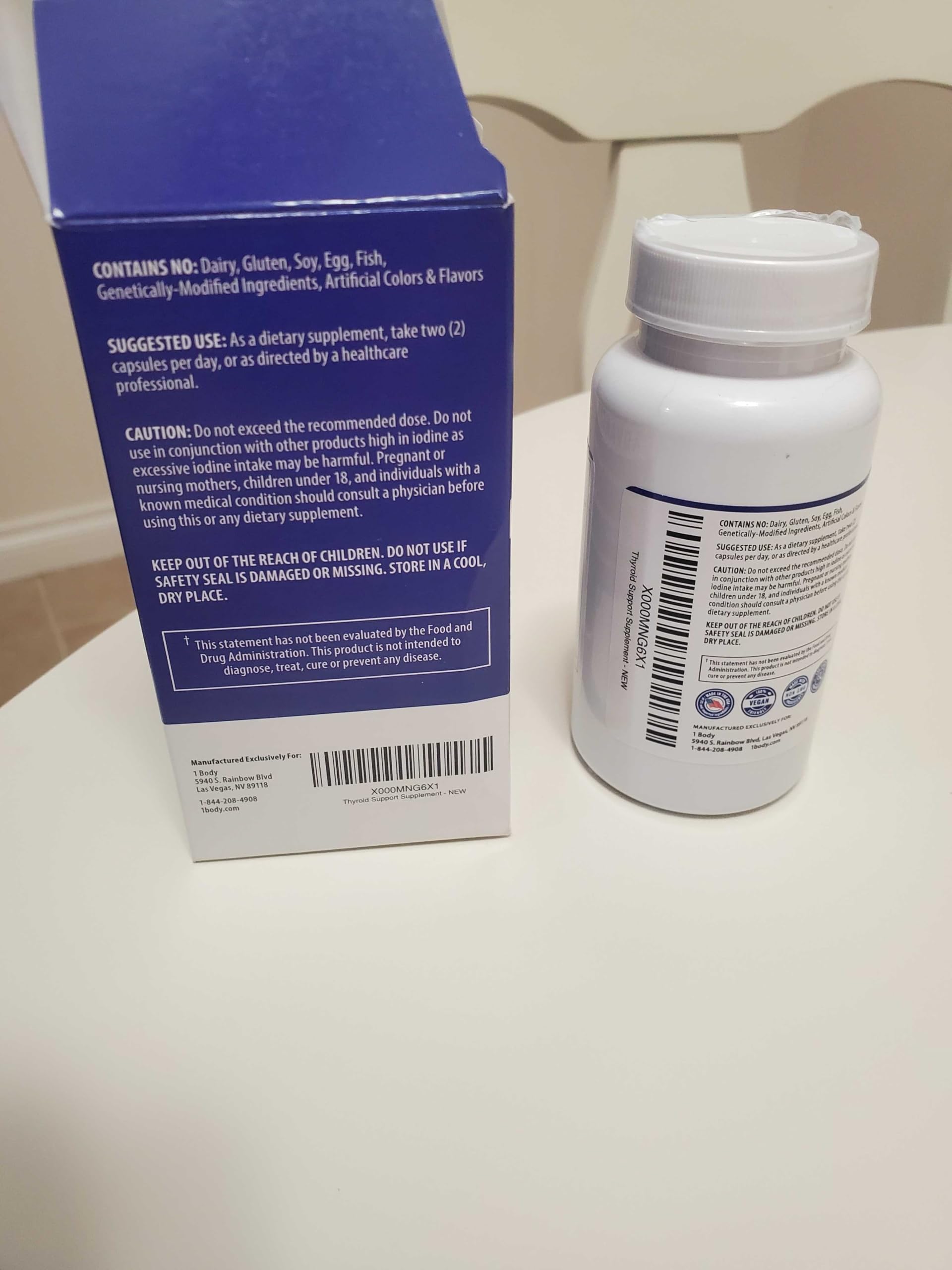 1 Body Thyroid Extract Supplement lifestyle shot with a glass of water