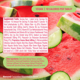 8Greens Super Greens Tablets on a wooden table with fruits