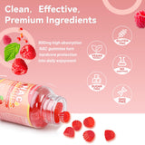 Agumoon NAC Support Gummies in a bowl with fresh raspberries