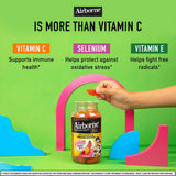 Airborne Kids Vitamin C Gummies with a glass of water