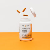 Alaya Naturals Turmeric Supplement bottle on a wooden table