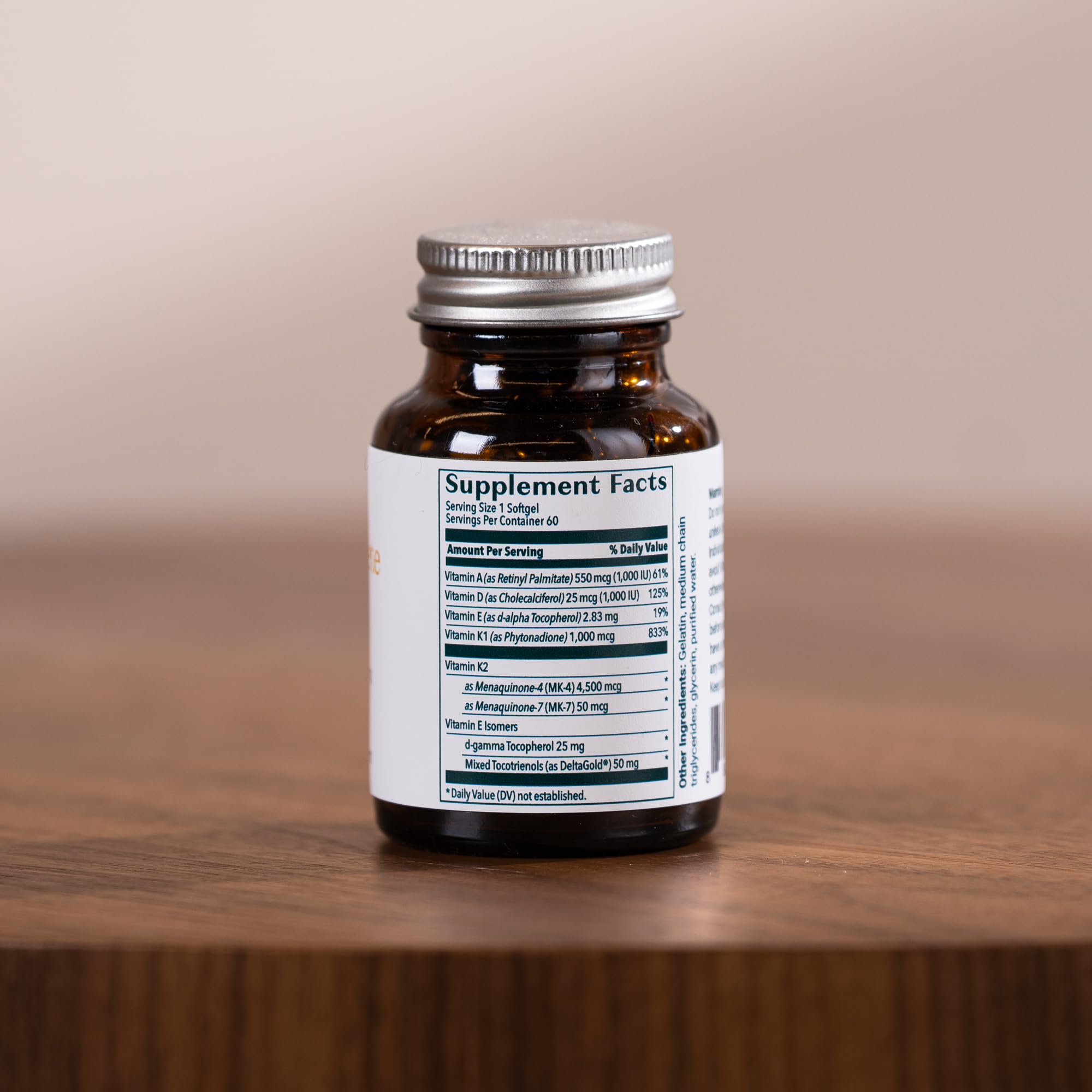 ALGAECAL D3 Complete Vitamin D3 & K2 softgel capsules in a hand