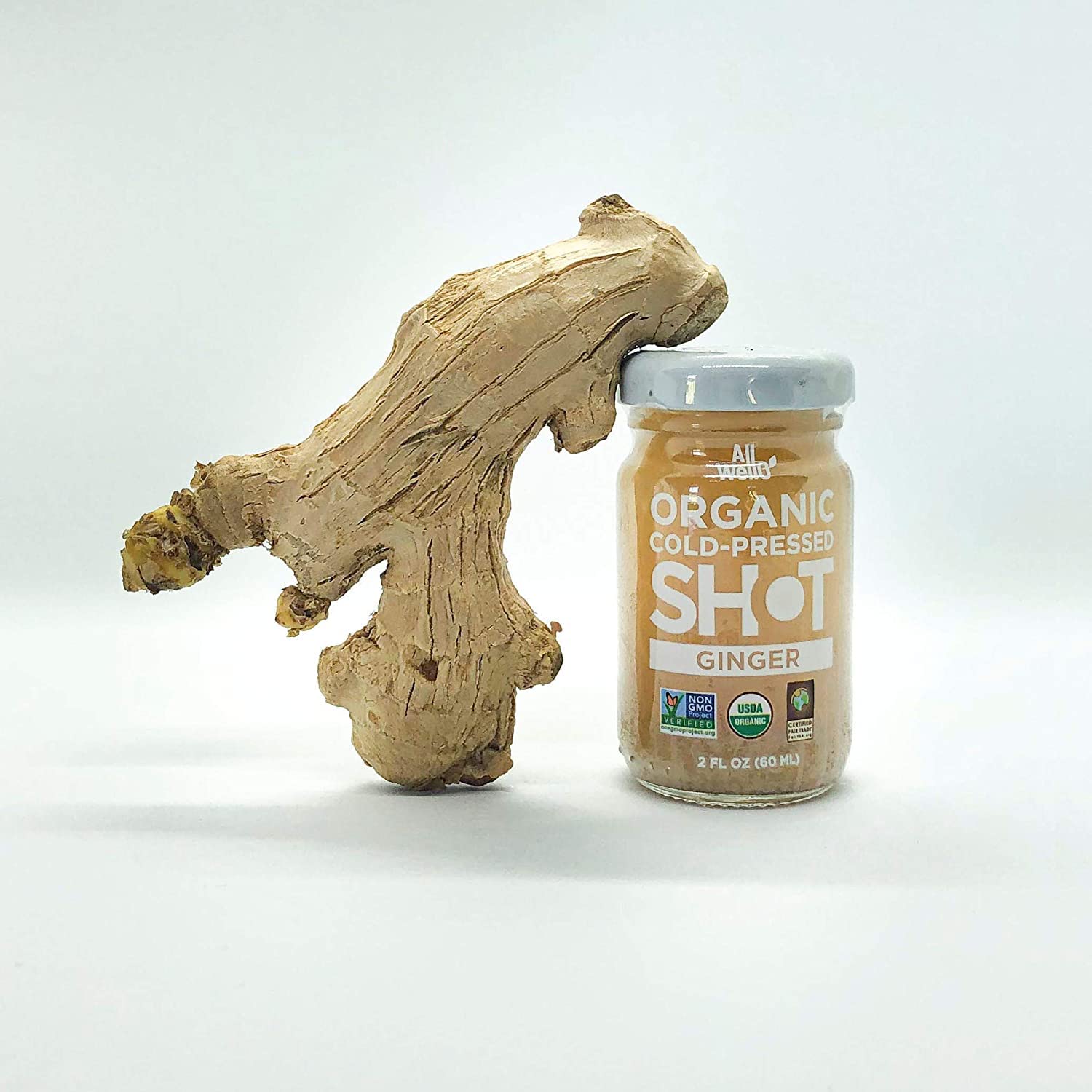 ALLWELLO Organic Ginger Wellness Shot lifestyle scene with fruits