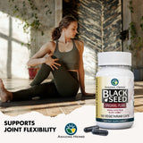 Amazing Herbs Black Seed Oil Capsules with a measuring spoon