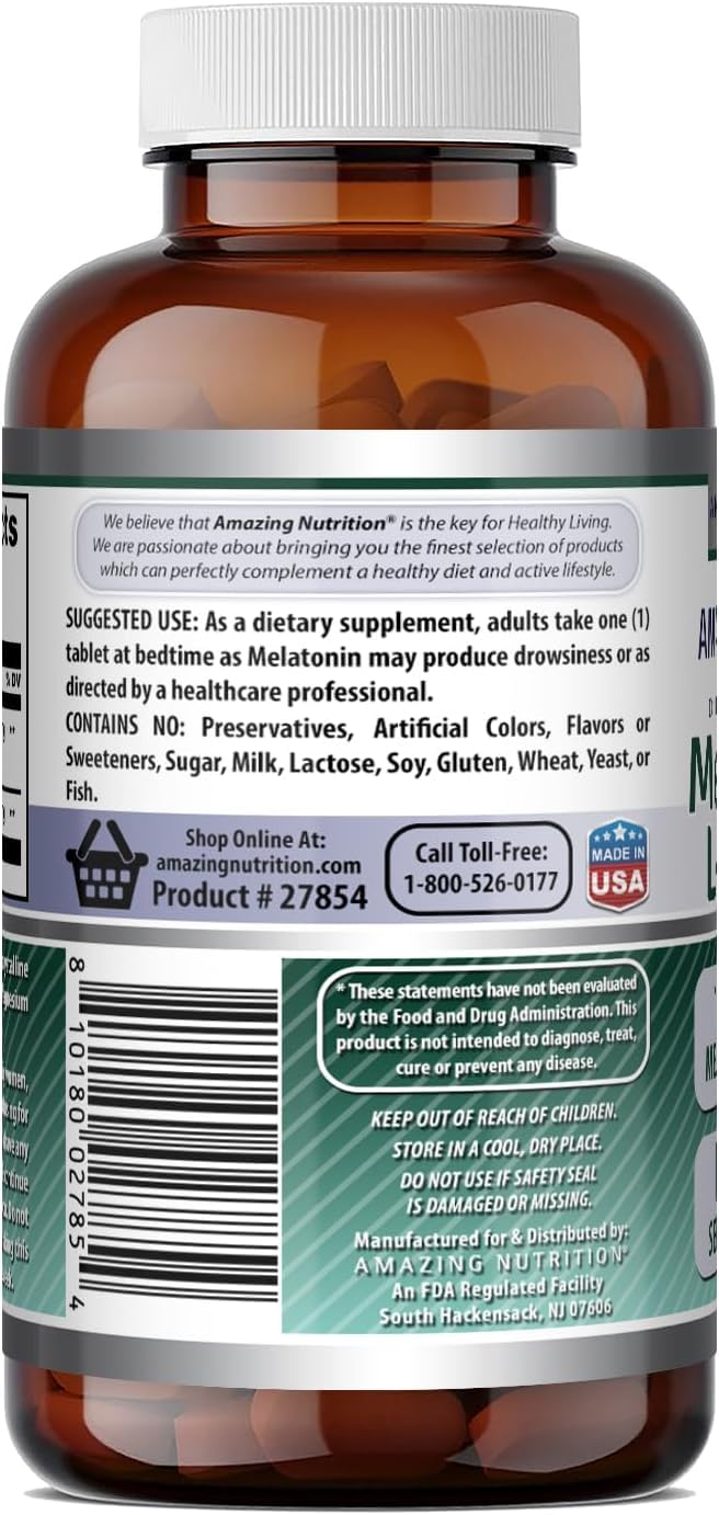 Amazing Nutrition Melatonin tablets on a wooden surface