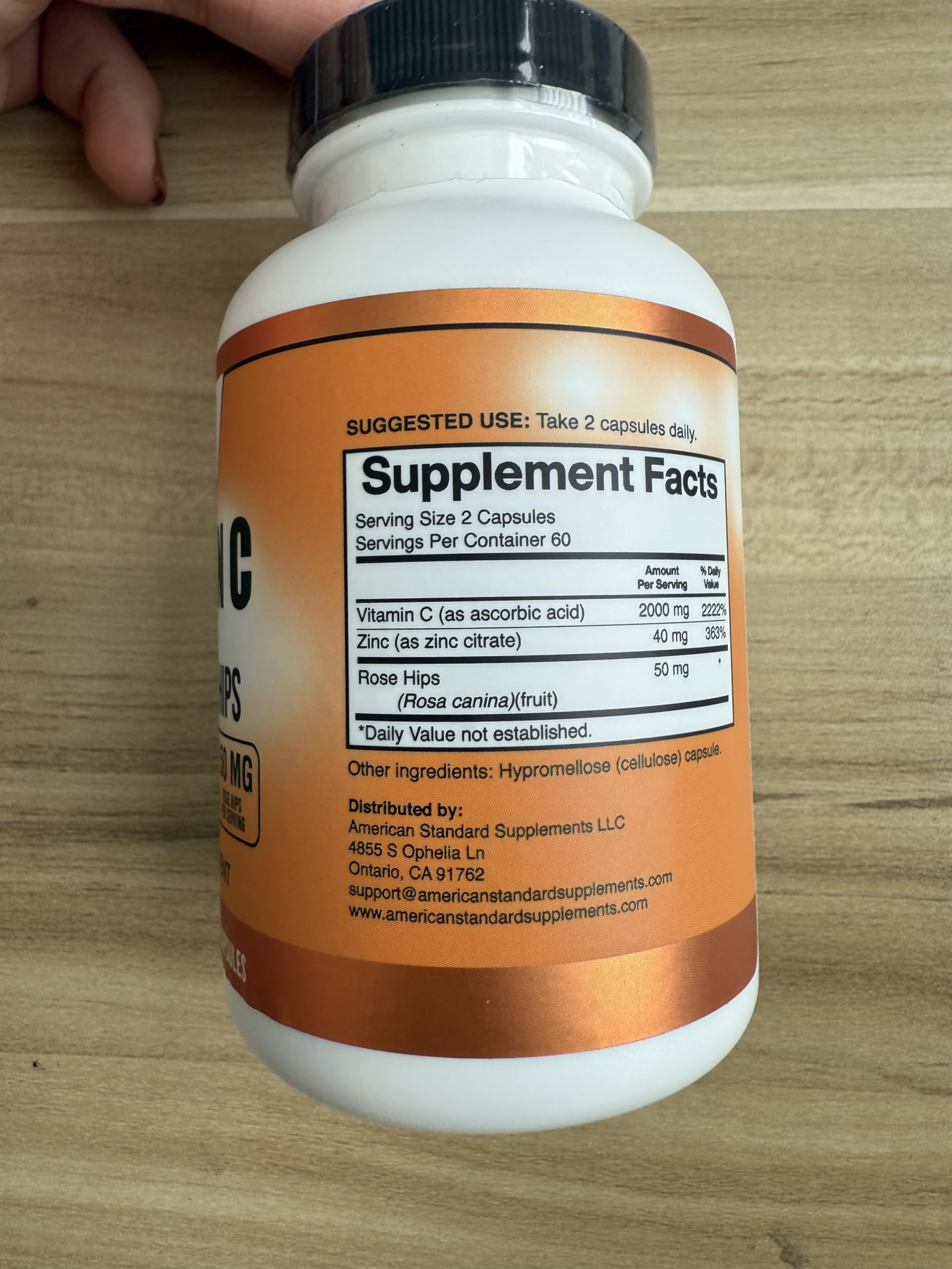 American Standard Supplements Vitamin C with Zinc and Rose Hips capsules with a measuring spoon