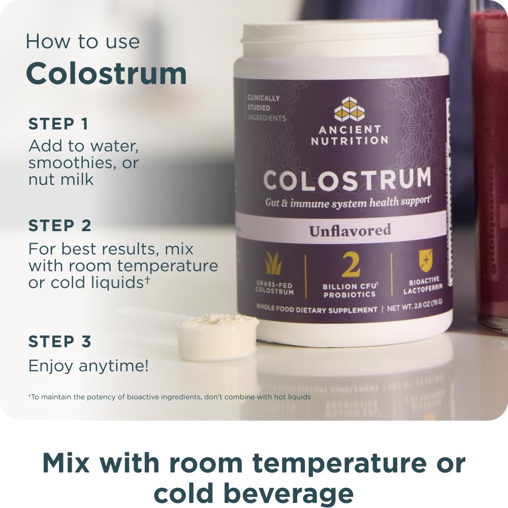 Ancient Nutrition Colostrum Powder in a glass of water