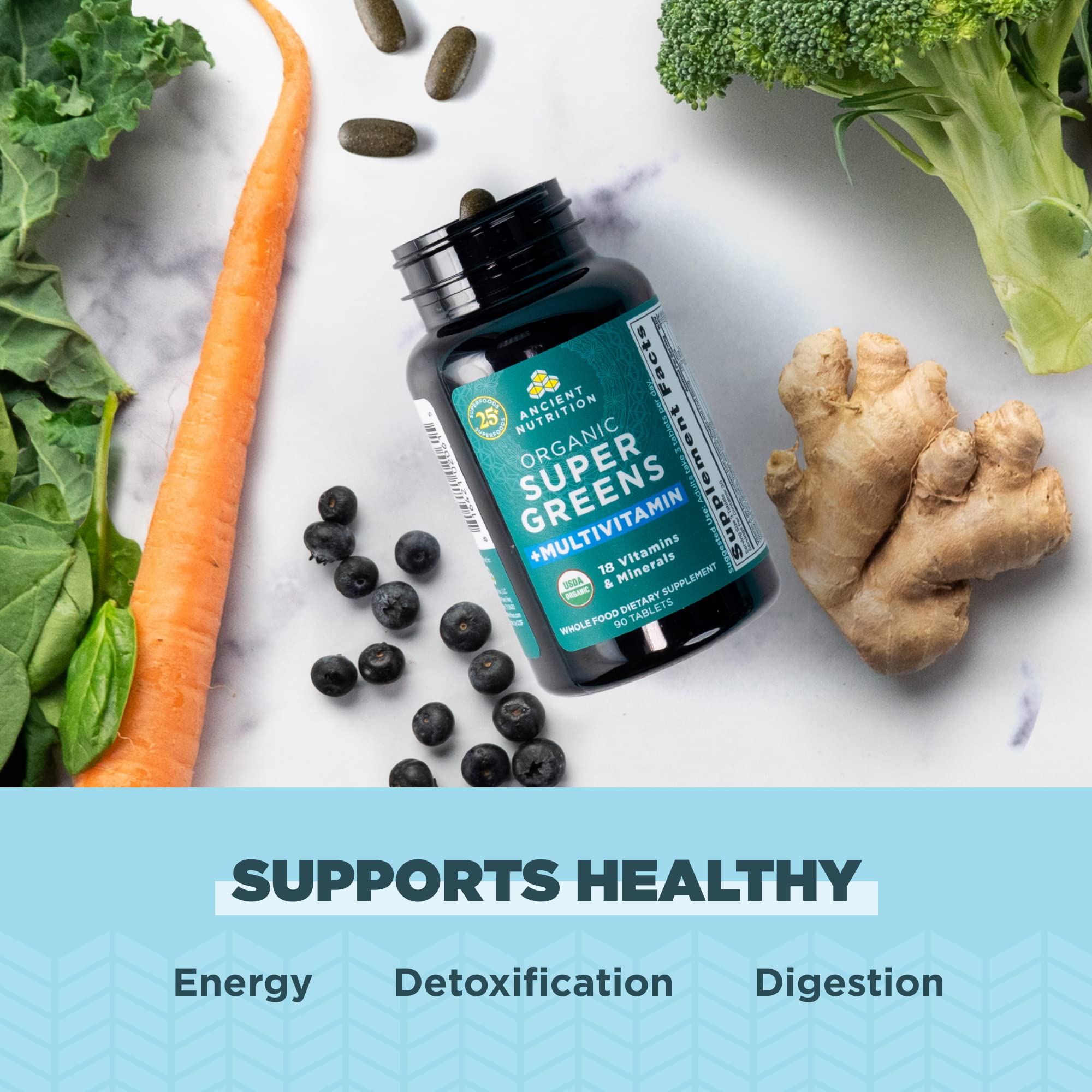 Ancient Nutrition Greens Superfood Blend scoop with powder on a wooden table