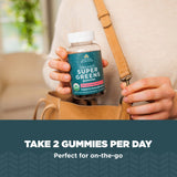 Ancient Nutrition Organic SuperGreens Gummies on a wooden table