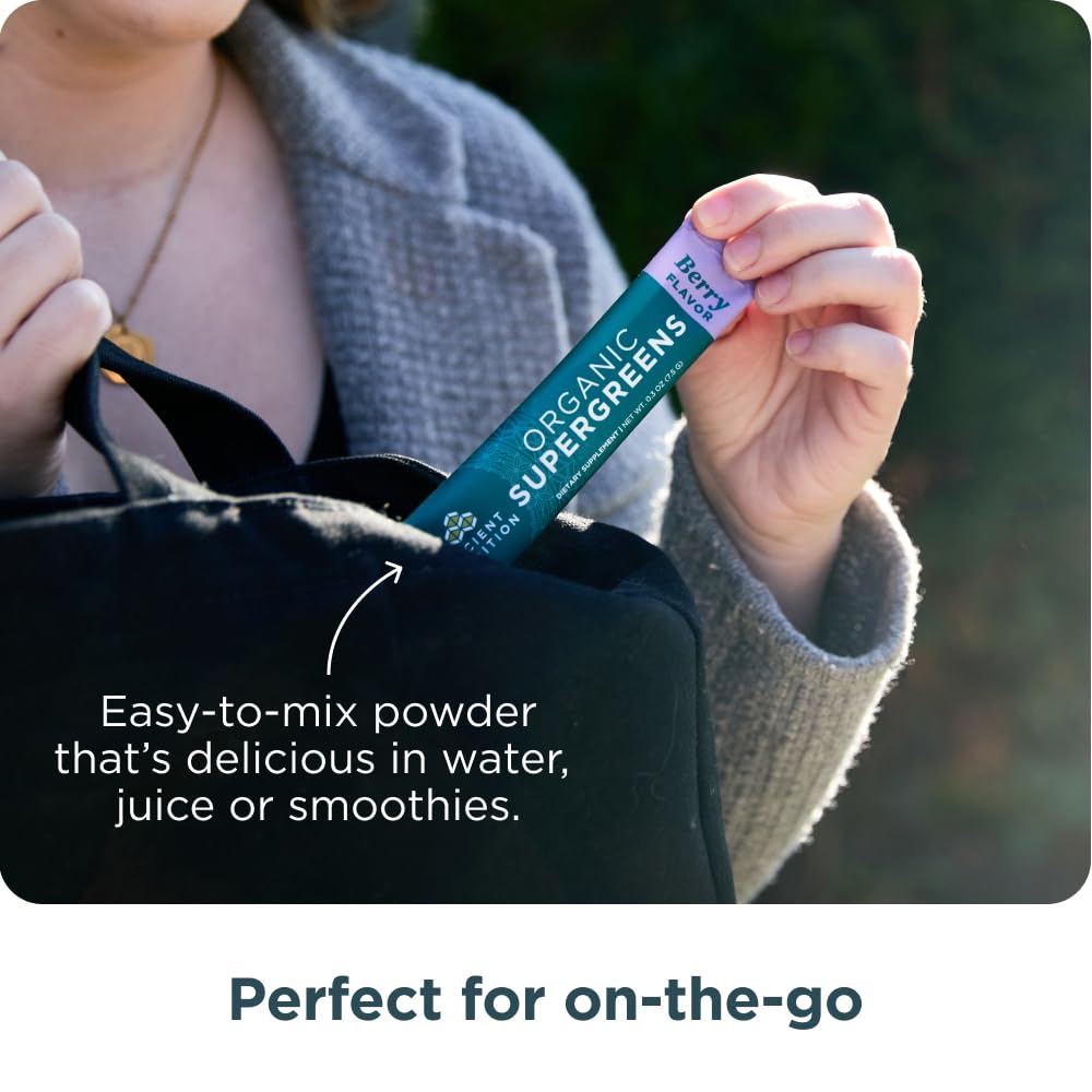 Ancient Nutrition Organic SuperGreens Powder in a glass of mixed smoothie