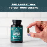 Ancient Nutrition Organic SuperGreens Tablets lifestyle scene with a glass of water