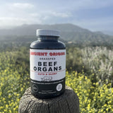 Ancient Origins Beef Organ Supplement 4500mg on a wooden table
