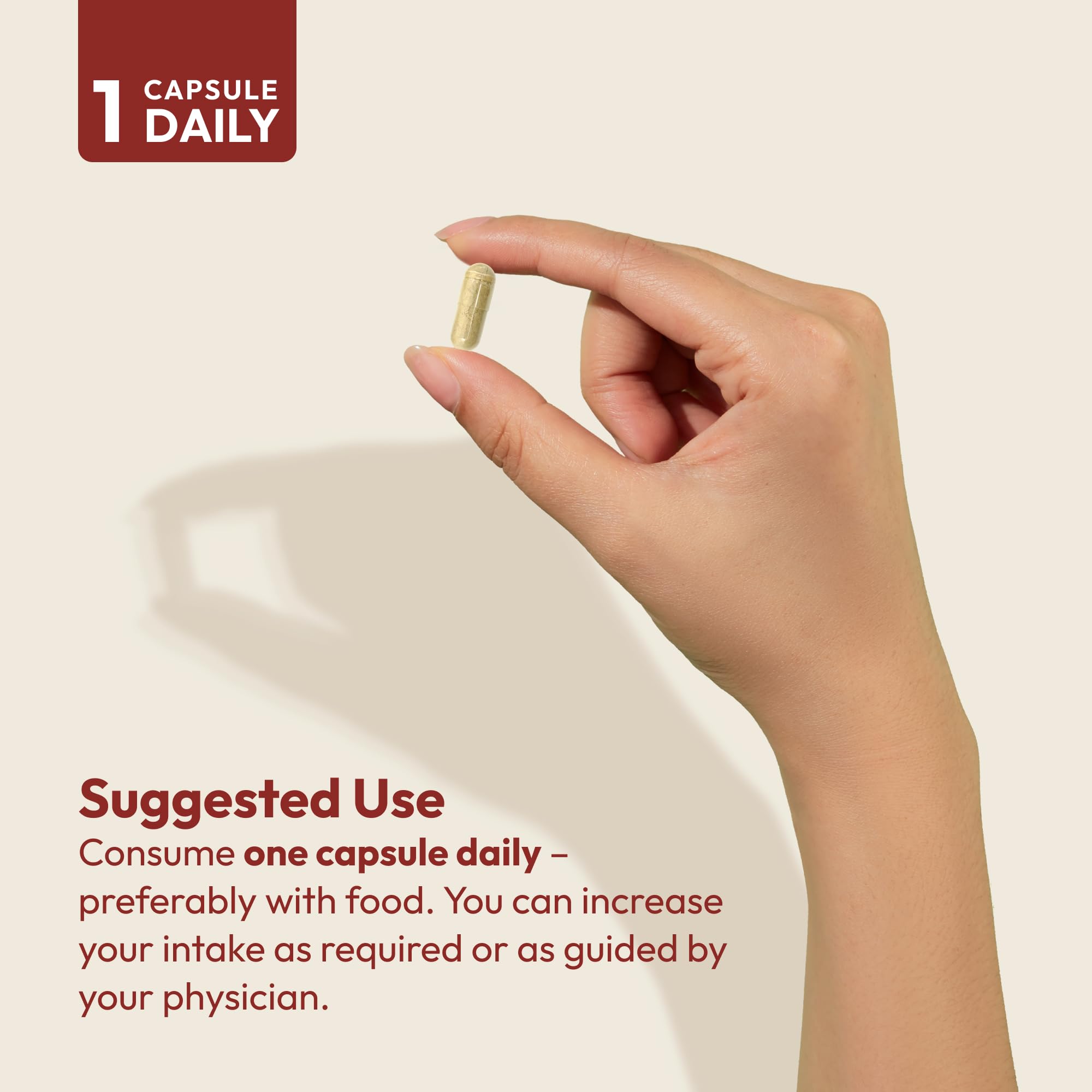 ANDREW LESSMAN Iron Supplement capsules in a hand