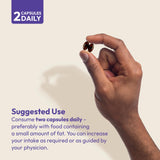 Andrew Lessman Lutein Eye Support Supplement capsules in a hand