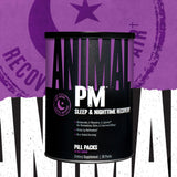 Animal PM Sleep Supplement capsules on a nightstand