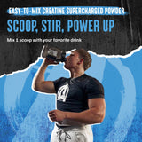 Animal Supercharged Creatine Monohydrate Powder 230g Watermelon with a glass of water