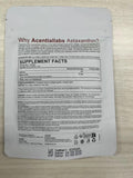 Arkture Astaxanthin Supplement with softgels on a wooden table