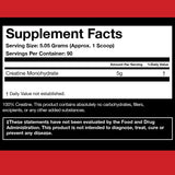 ATHLEAN-X Creatine Monohydrate 540g on a fitness mat