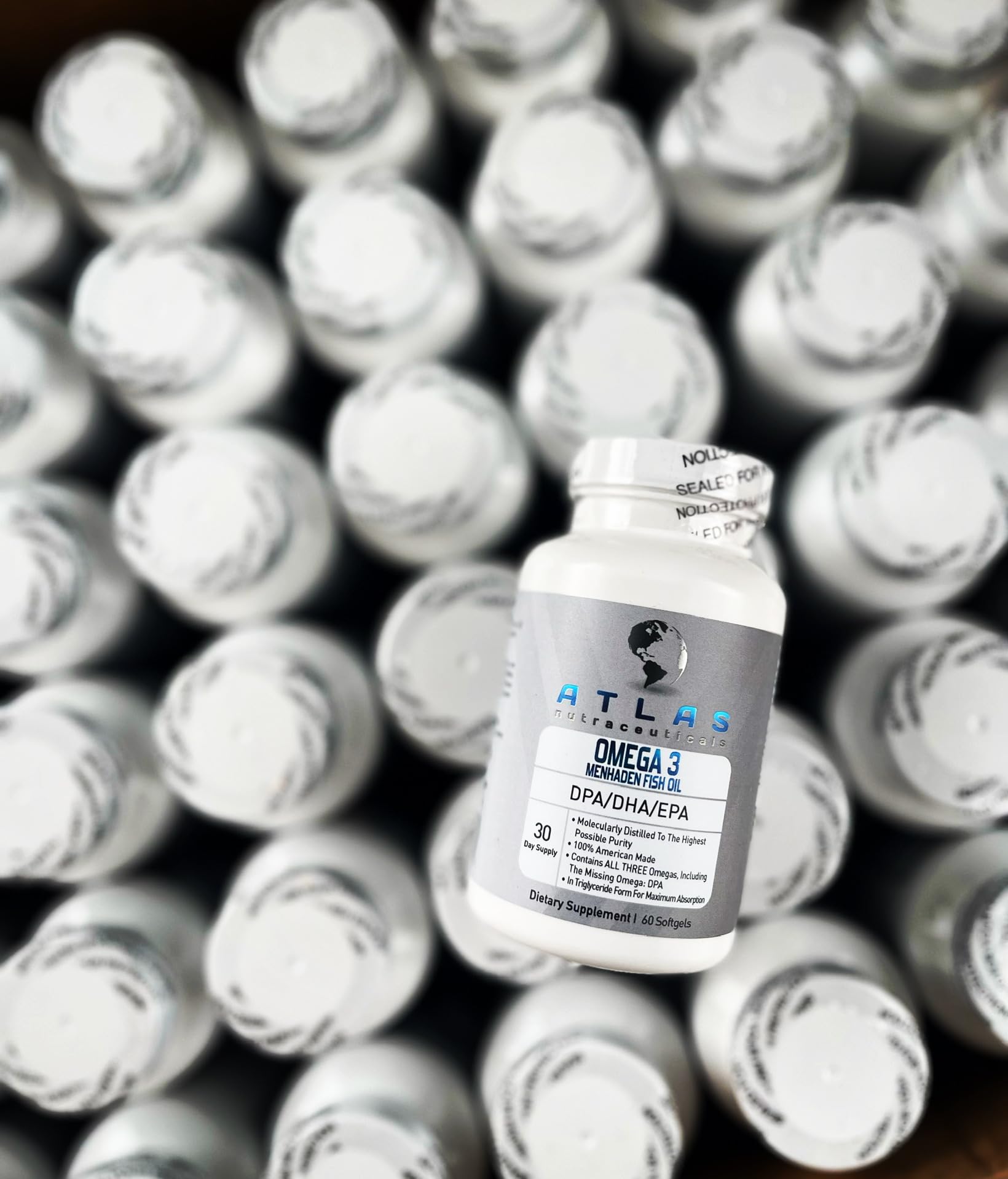 Atlas Nutraceuticals Omega 3 Fish Oil softgels with fresh fish