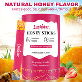 AUIXOPI Shilajit Strawberry Honey Sticks in a glass of water