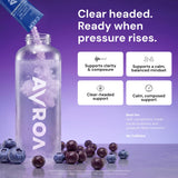 AVRO Calm Blueberry Acai Drink Mix powder in a glass of water
