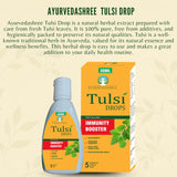 AYURVEDASHREE Tulsi Drops with a dropper in a glass of water