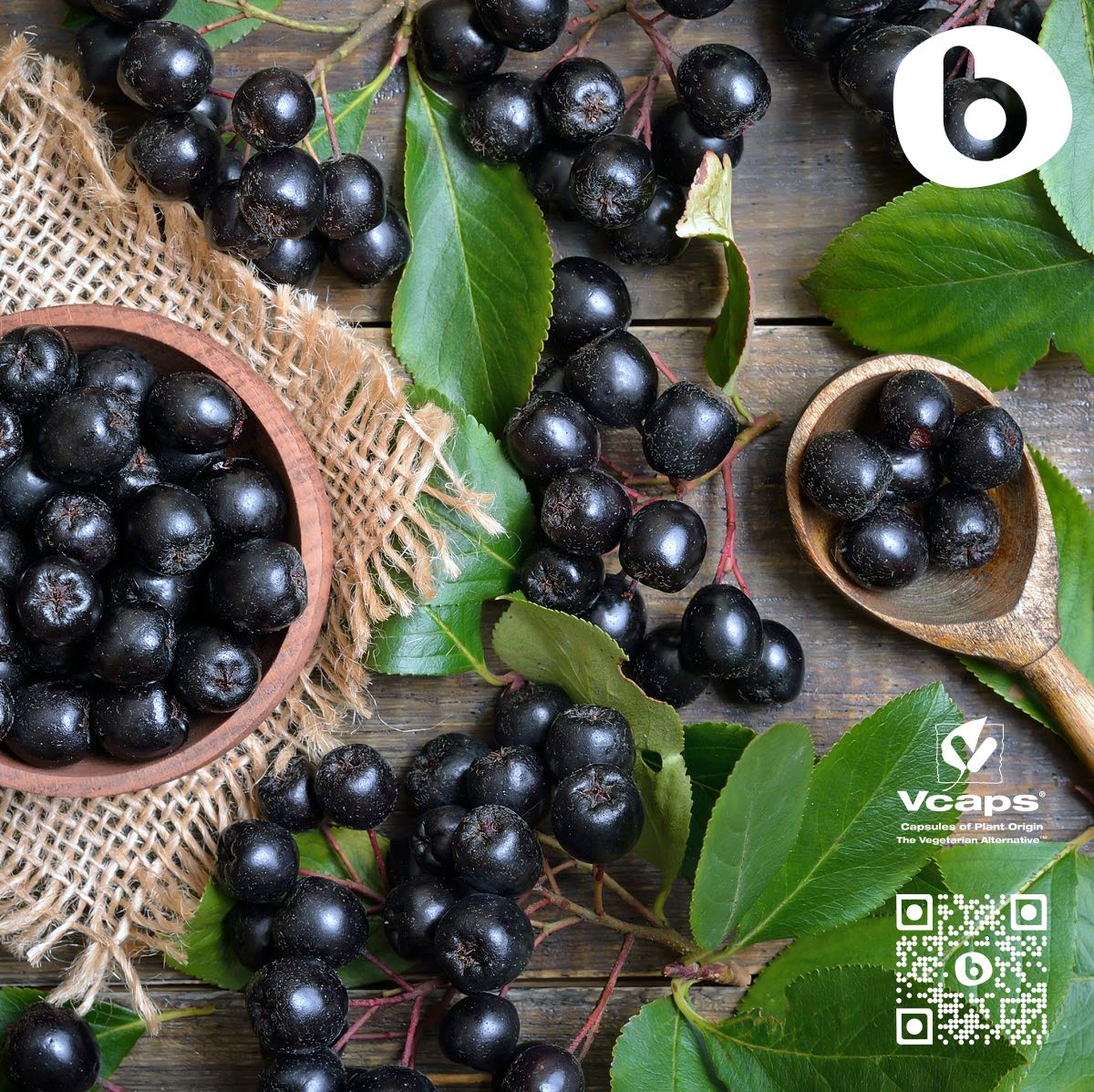 b Organic Aronia Berry Capsules alongside a glass of water