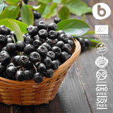 b Organic Aronia Berry Capsules displayed on a wooden table
