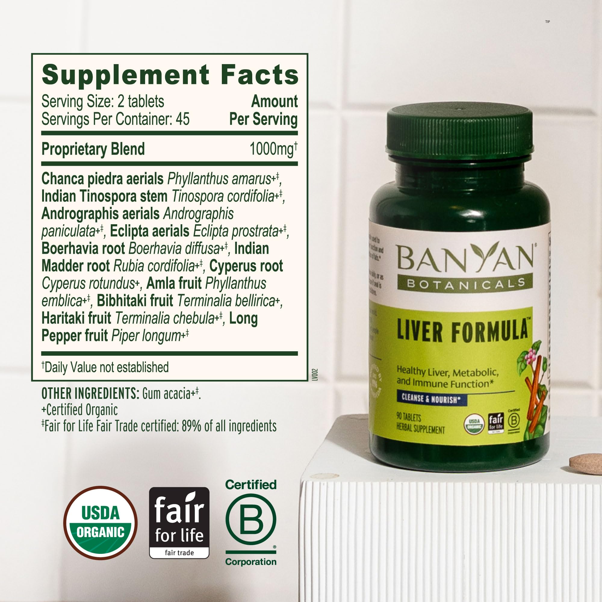 Banyan Botanicals Liver Formula 500mg tablets on a wooden table