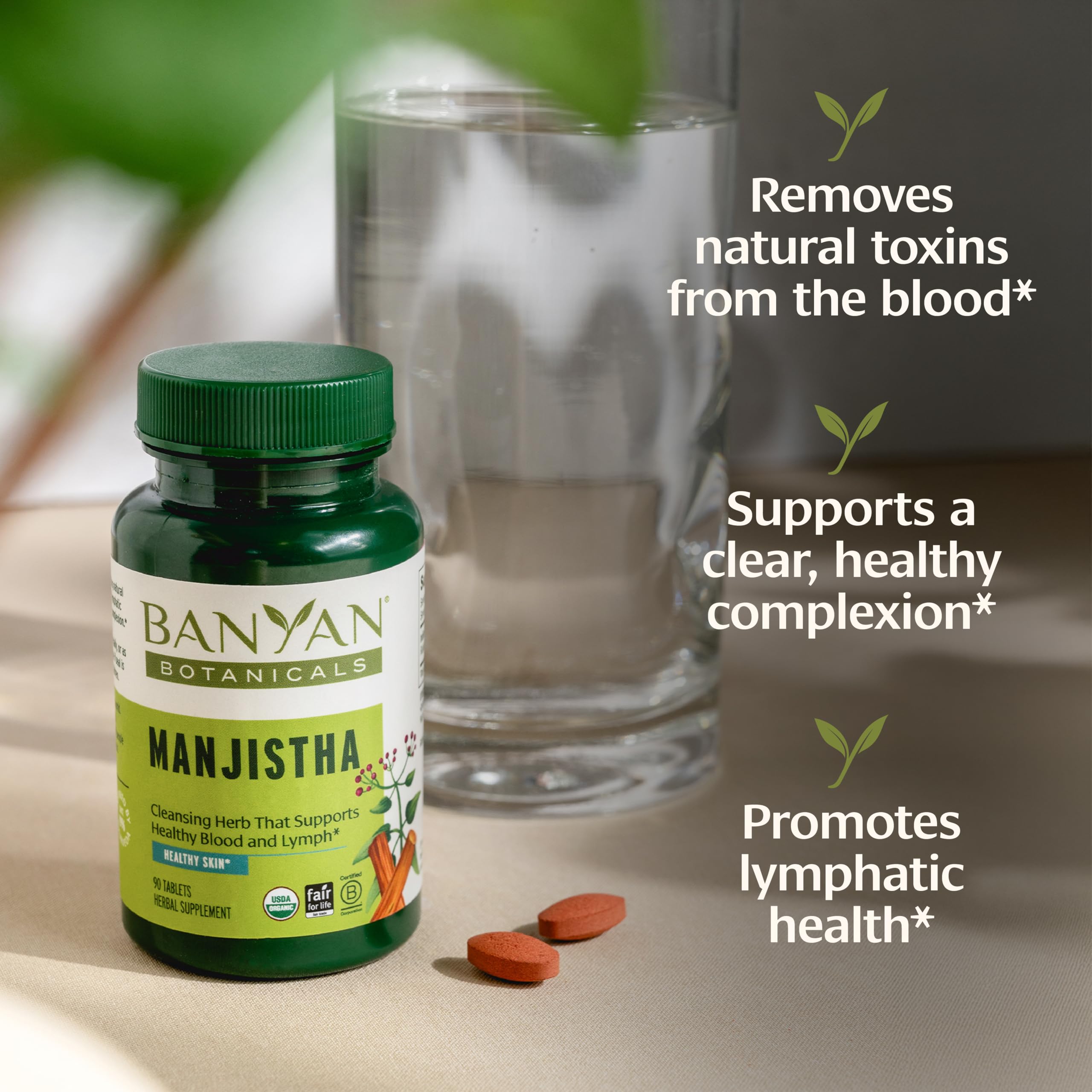 Banyan Botanicals Manjistha Herbal Supplement displayed on a wooden table