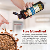 Barlean's Lignan Flax Oil 945g pouring into a spoon