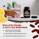 Barlean's Total Omega Softgels on a wooden table