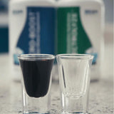 BEAM MINERALS Daily Energy Support Supplement with a glass of water