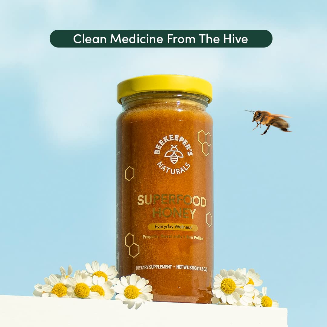 Beekeeper's Naturals Superfood Honey 125g on a wooden table