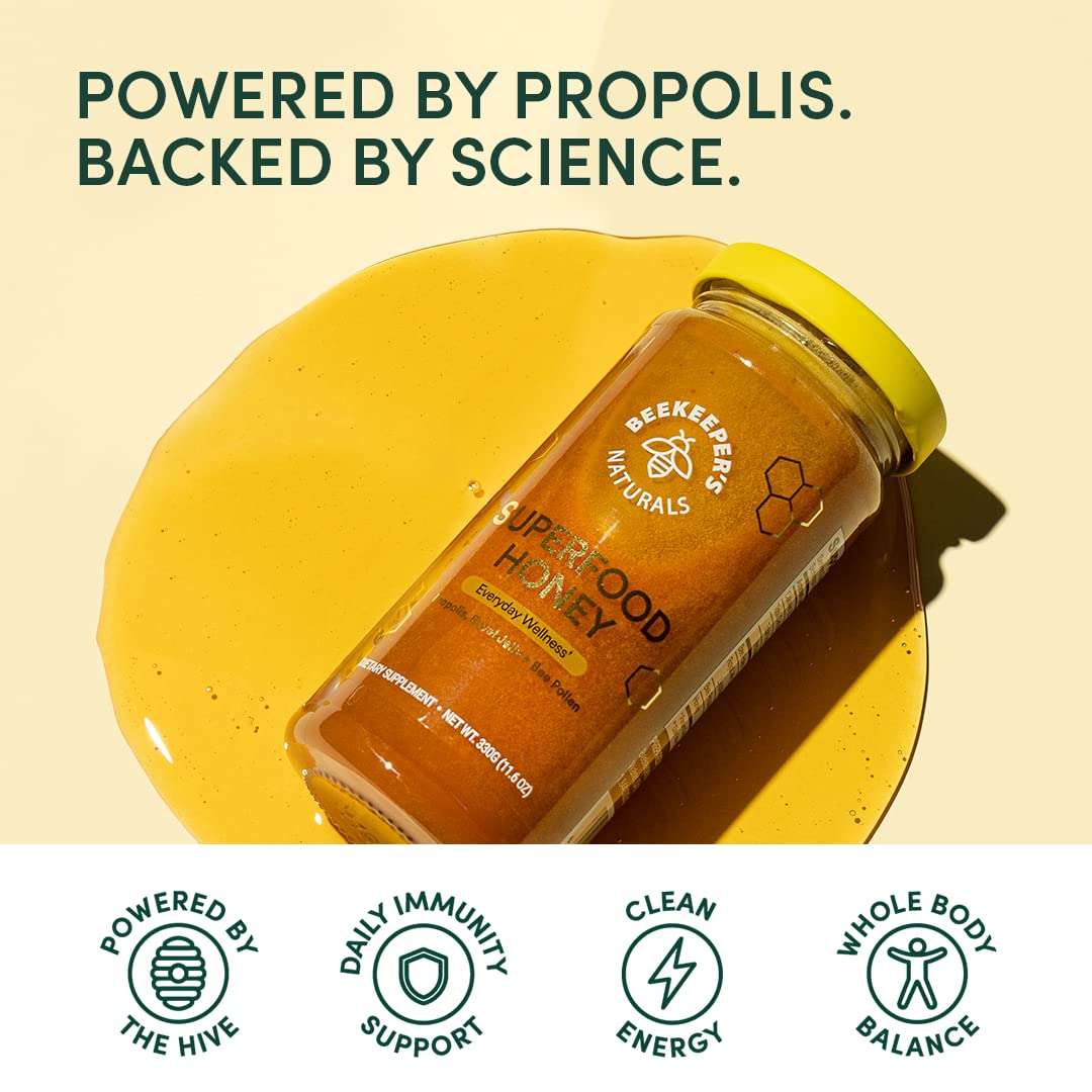 Beekeeper's Naturals Superfood Honey 329g on wooden table