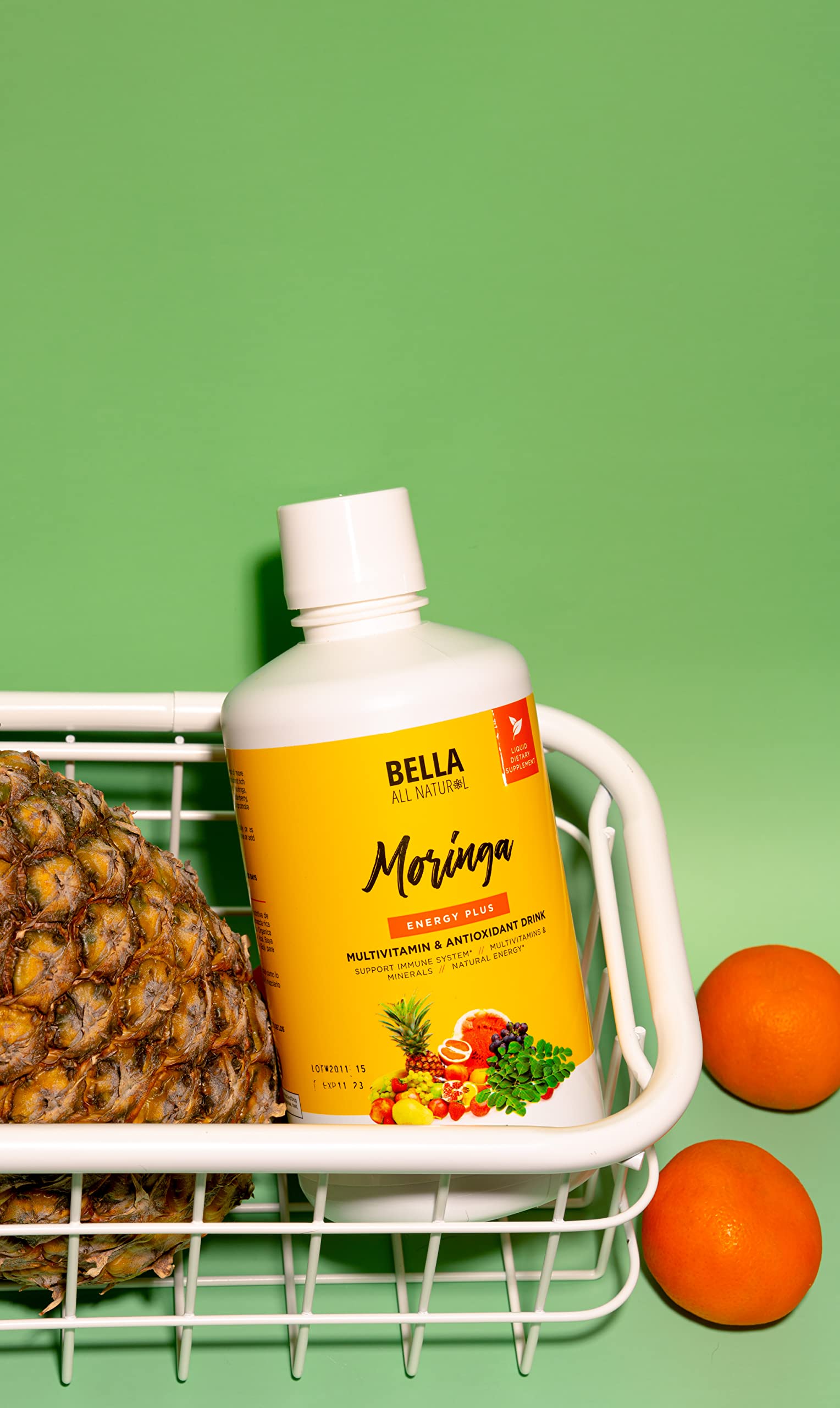 Bella All Natural Moringa Juice 907g with glass of juice