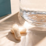 Bio.me Psyllium Husk Capsules with a measuring spoon