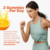 BionerLab Potassium Magnesium Gummies with a hand holding gummies