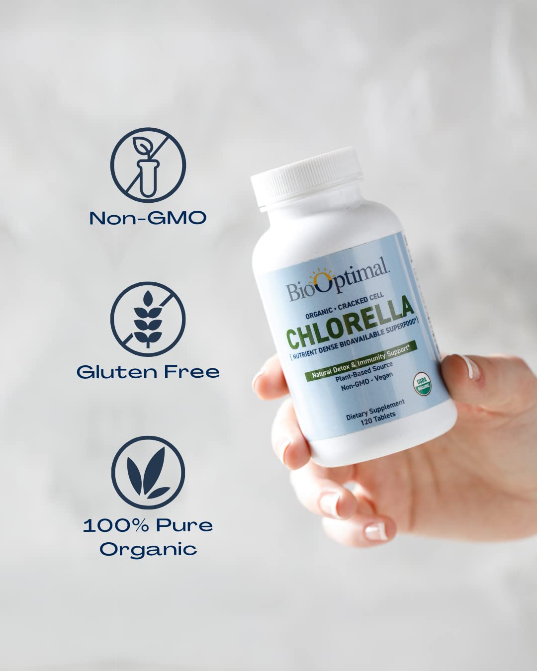 BioOptimal Chlorella Tablets 500mg on a wooden table