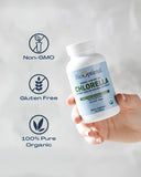 BioOptimal Chlorella Tablets 500mg on a wooden table