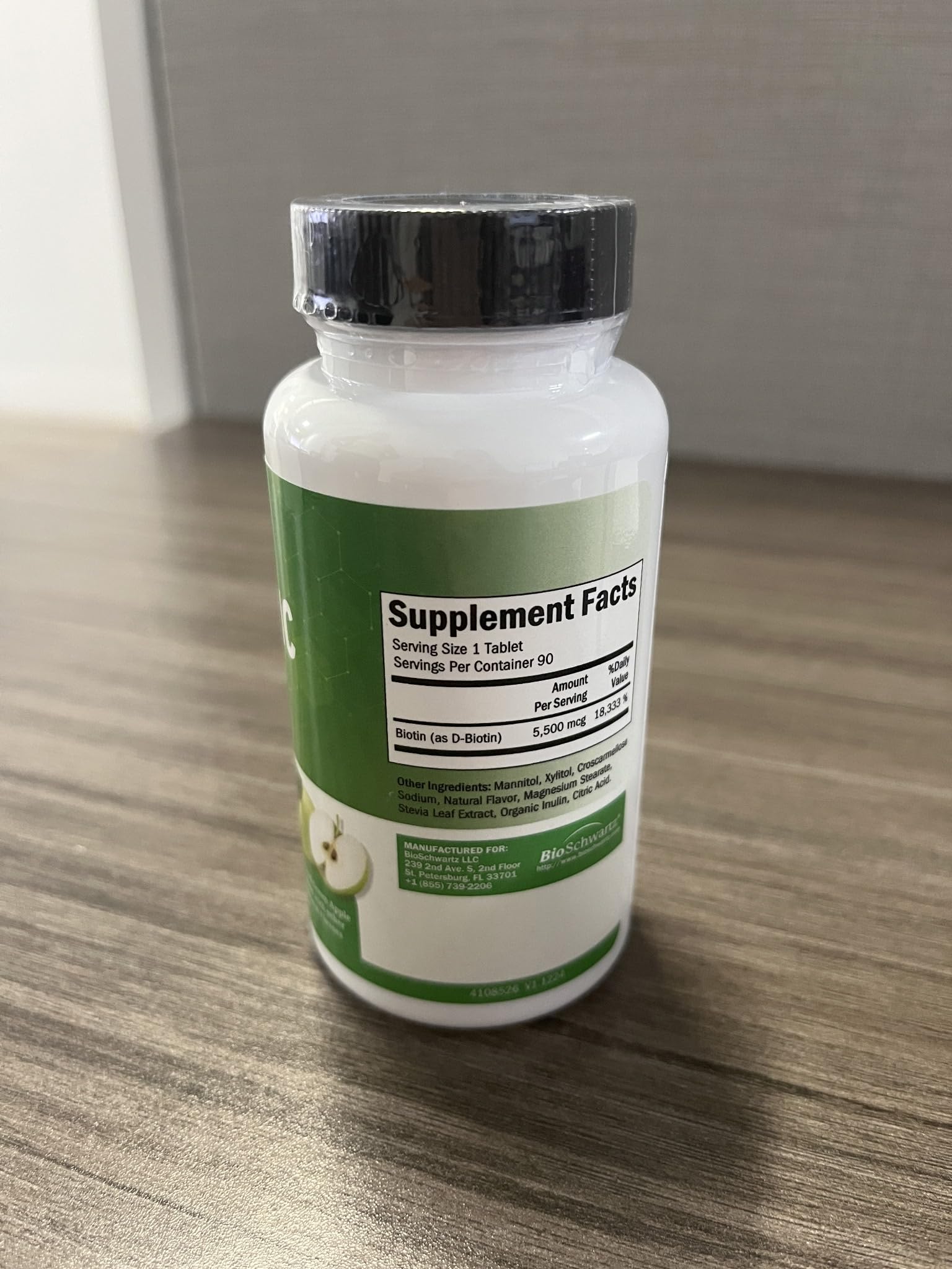 BioSchwartz Biotin Supplement 5500mcg bottle with a measuring spoon