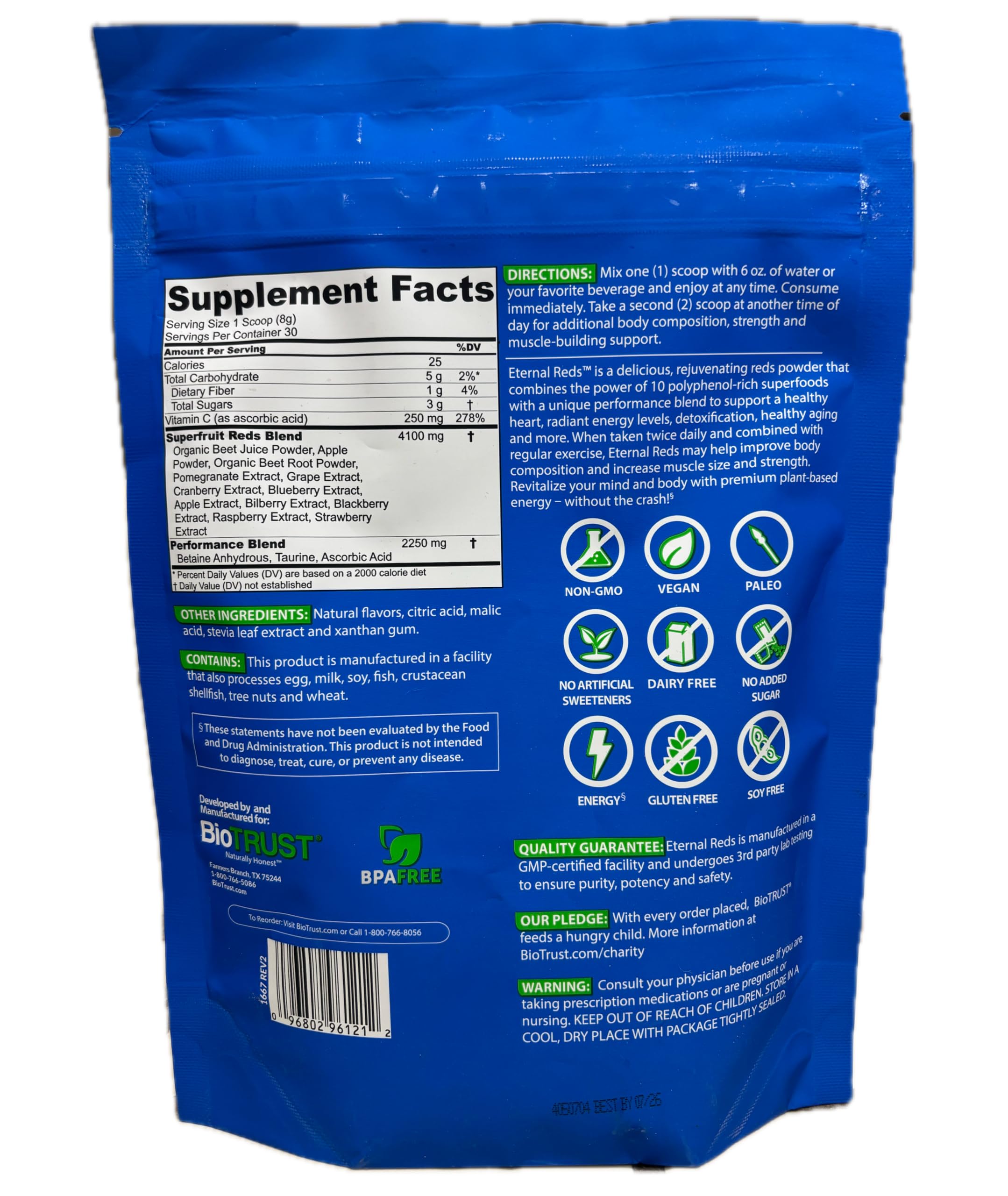 BioTrust Eternal Reds Superfood Powder in a glass of water