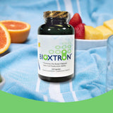 Bioxtron Spirulina Capsules displayed with natural ingredients