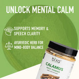 bixa BOTANICAL Calamus Root Powder in a glass of water