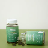 Black Girl Vitamins Ashwagandha + Zinc Gummies on a wooden table