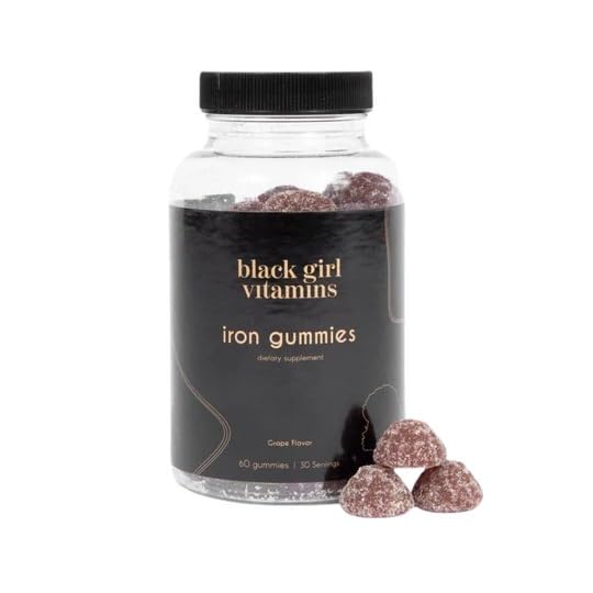 Black Girl Vitamins Iron Gummies with a hand holding the gummy