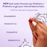 Black Girl Vitamins Vaginal Probiotic Gummies with a hand holding a gummy