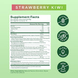 Bloom Nutrition Greens & Superfoods Powder mixed in a glass