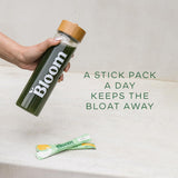 Bloom Nutrition Greens & Superfoods Powder on a kitchen counter