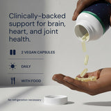 Blueprint Bryan Johnson Omega-3 Vegan Supplement in a hand